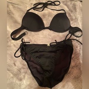 Victoria’s Secret black bikini. 36 B top. Medium bottoms.
